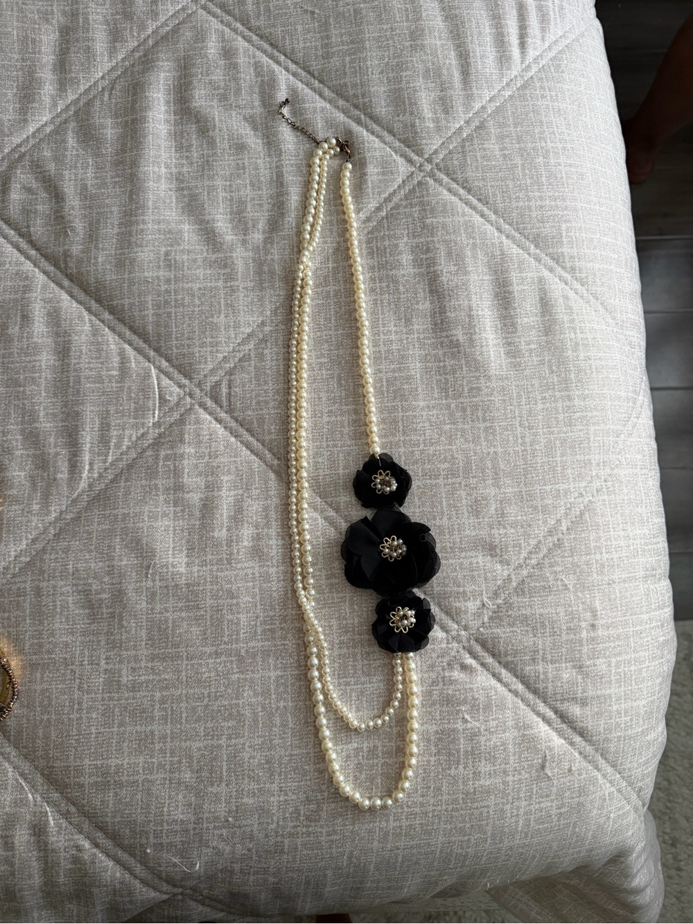 Long Pearl Strand Necklace with Black Floral Accents